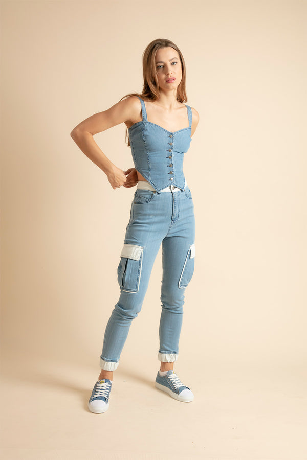 Girl in cargo jeans with white leather and denim top