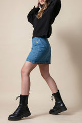 Short denim skirt with studs profile view