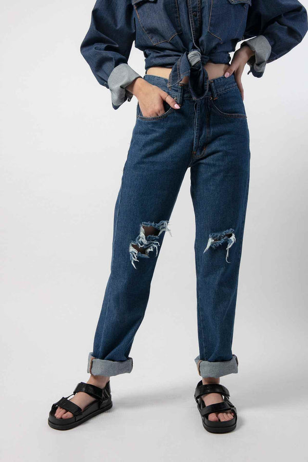 Denim pants with rips at the knees